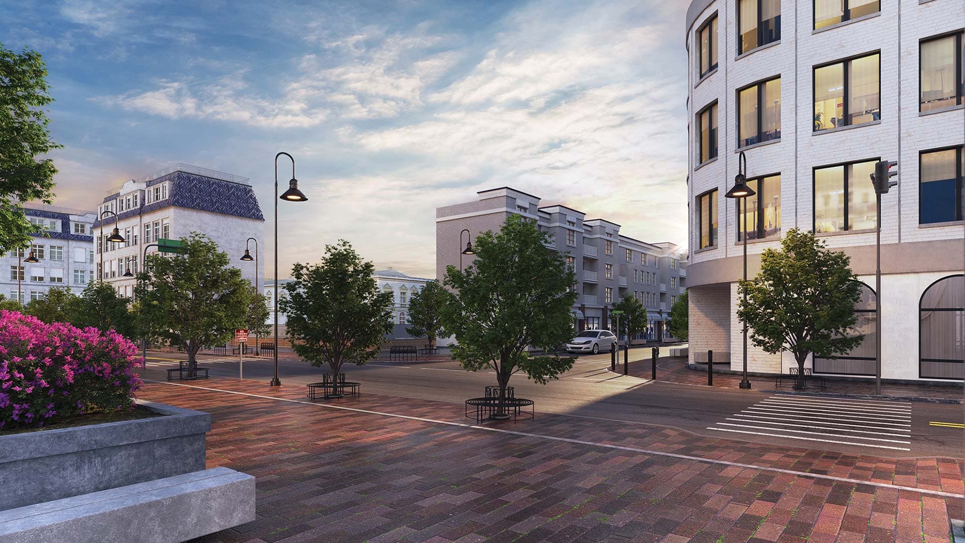 Roadway lighting at dusk with GlasWerks® LED Hallbrook® Extended Luminescent Pendant Series.