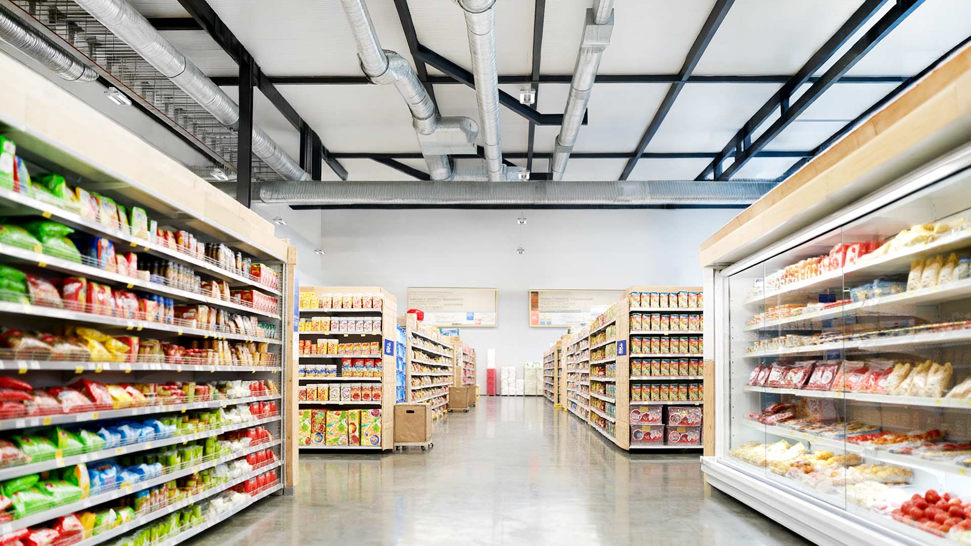 Lithonia’s Beyond Linear LED High Bays light grocery store aisles 
