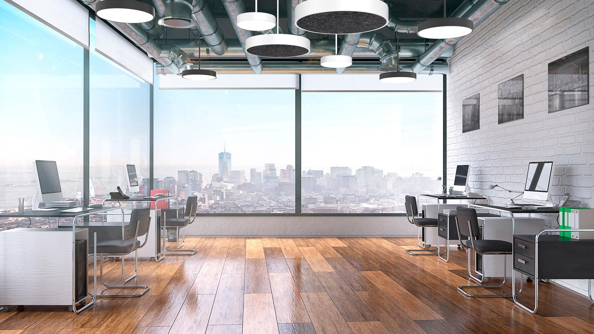 Direct ceiling luminaire in open office with desks.
