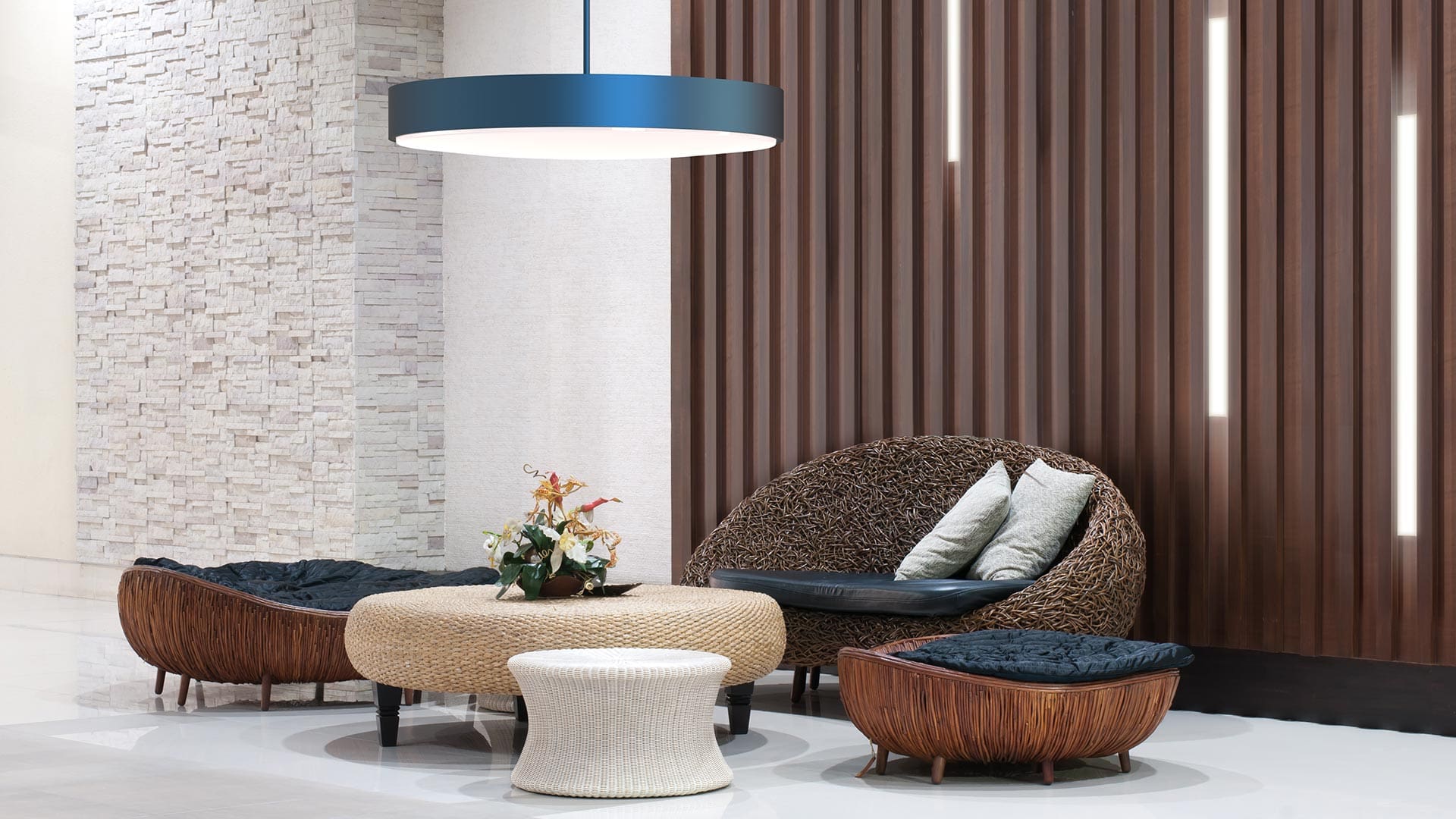 Direct ceiling luminaire in lobby sitting area.